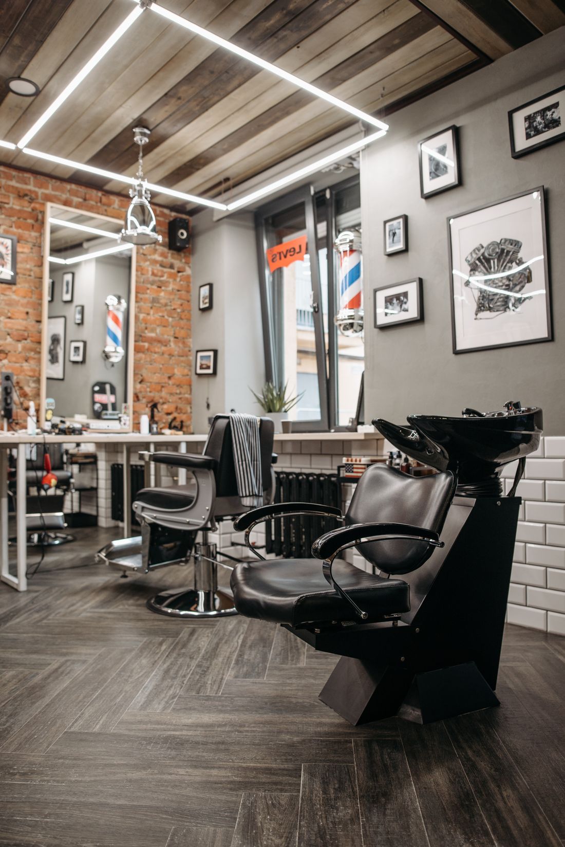 Inside Sharp & Co. Barbers: a clean, modern shop floor lined with classic barber chairs